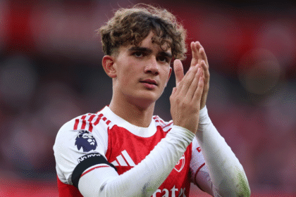 Player applauding fans after match.